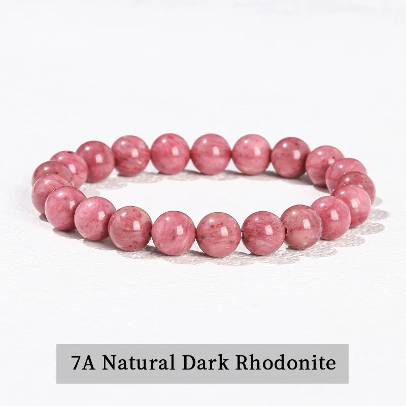 A bracelet made of 7A Natural Dark Rhodonite beads in a pink color.