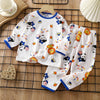 White long sleeve cotton pajama set for kids featuring cute animal patterns like cats and bears