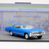 Blue 1967 Chevrolet Impala diecast model car in pull-back action on a gray surface.
