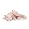 A light pink rainbow dragon plush pillow with soft fur and wings.