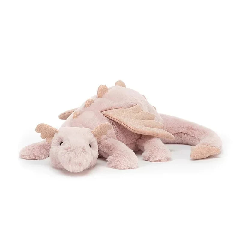 A light pink rainbow dragon plush pillow with soft fur and wings.