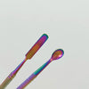 A close-up of a colorful stainless steel clay sculpting tool set featuring two elongated tools.