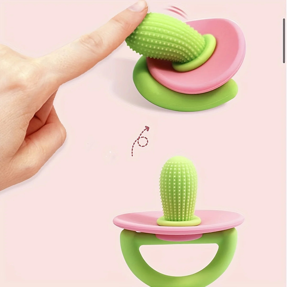 A hand is holding a silicone teething ring and pacifier tool, showing the product in green and pink colors.