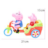 A pink piggy ride-on toy car with a pink pig figure and music features, measuring 15cm tall and 21cm long.