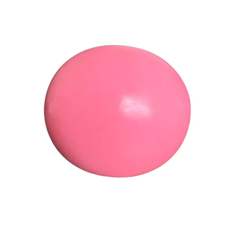 A smooth, pink, spherical squishy ball for stress relief and fidgeting.