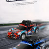 Two racing speed camera remote control cars in blue and orange are shown on an asphalt track.