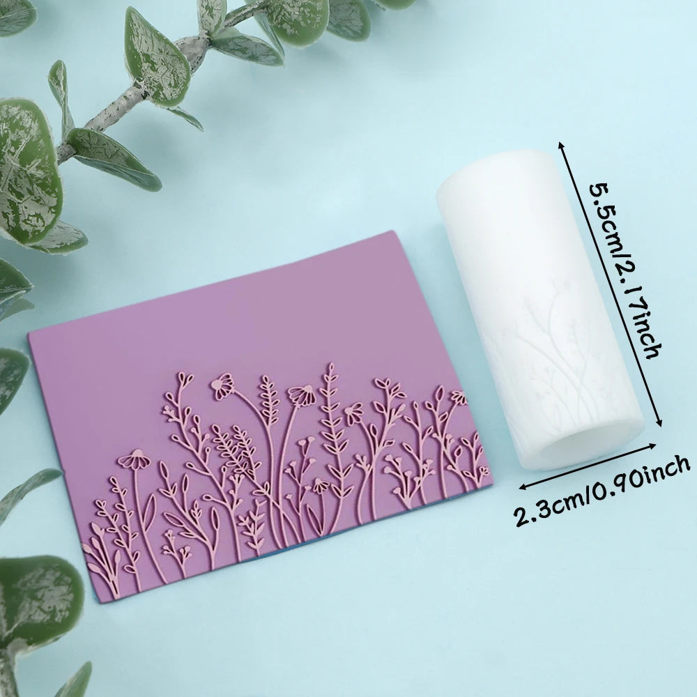 A pink clay texture roller with a floral pattern is shown next to a white roll, illustrating the product's size.