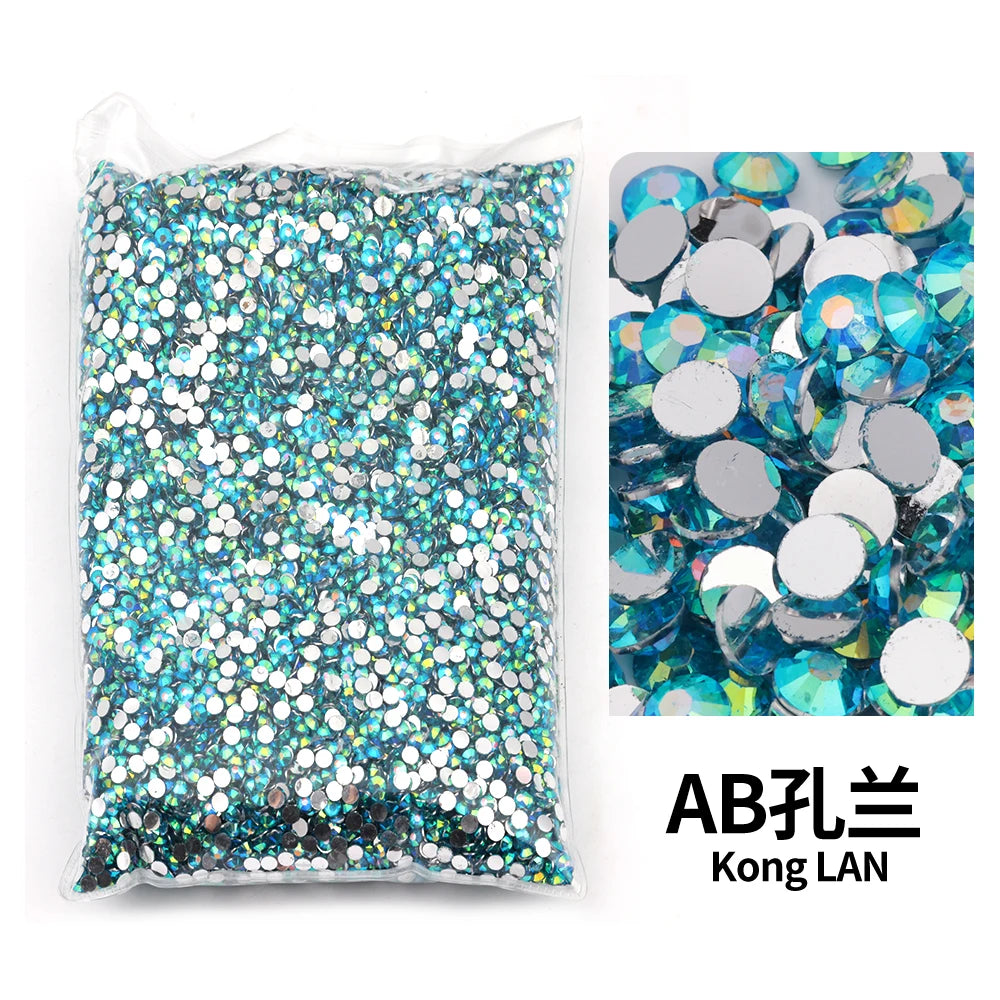 Bag of flat-back resin rhinestones in various shades of blue and silver for DIY craft and nail art