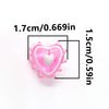 Pink lampwork glass beads shaped like hearts used for jewelry making