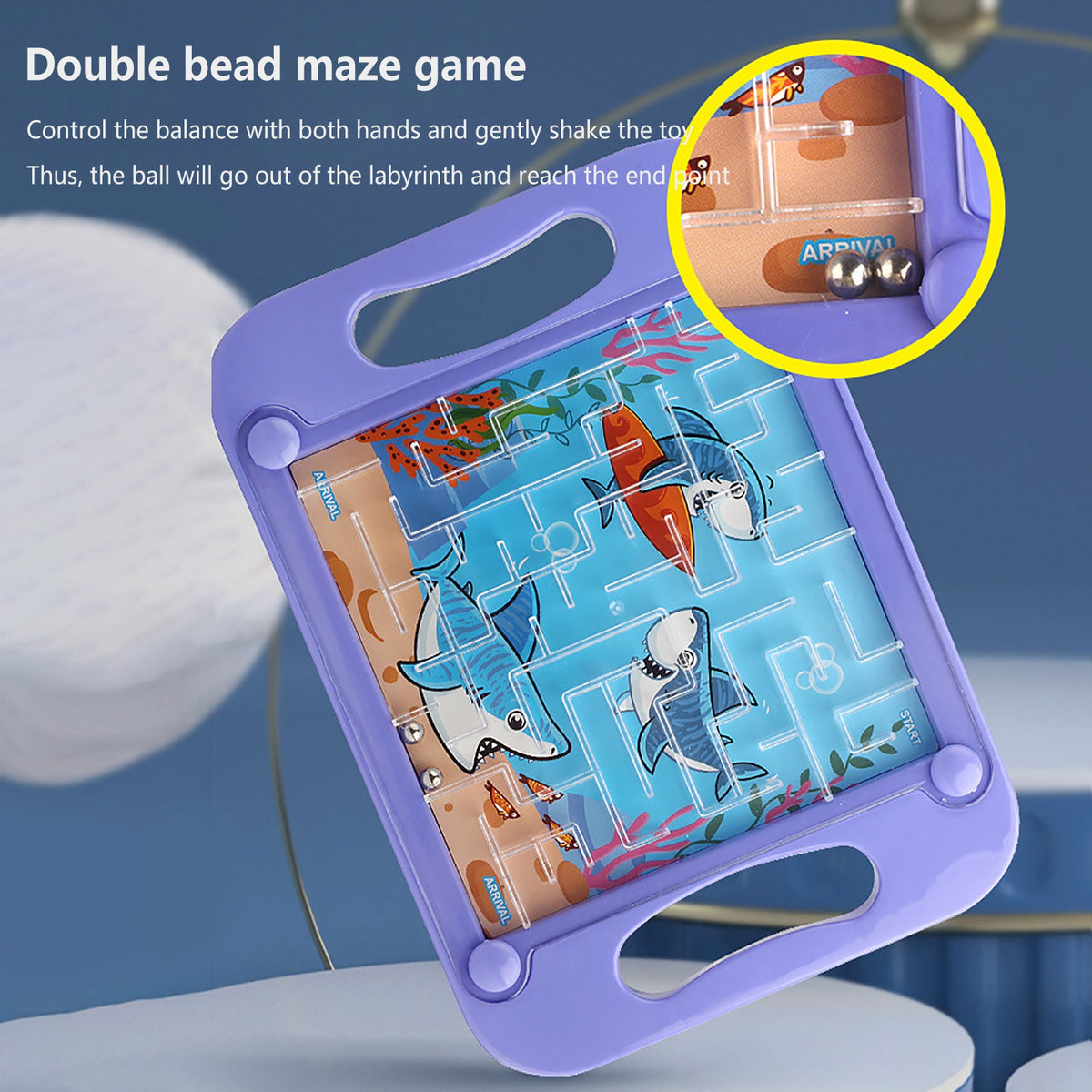 A purple plastic maze game board with colorful fish figures and a ball, demonstrating a double bead maze balancing puzzle.