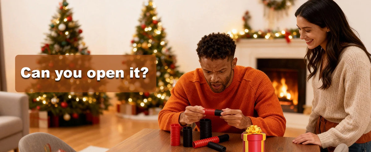 A man is opening a red nested screw gift box in a living room setting.