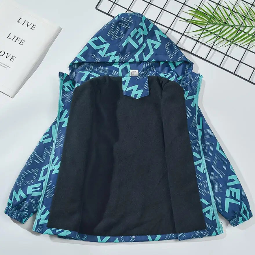 A dark blue and teal kids waterproof winter jacket with a hood displayed on a white surface.