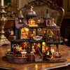 A detailed wooden miniature castle dollhouse kit featuring architecture, furniture, and illuminated elements.