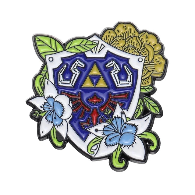 A colorful enamel pin featuring a shield design with floral elements and stylized letters.