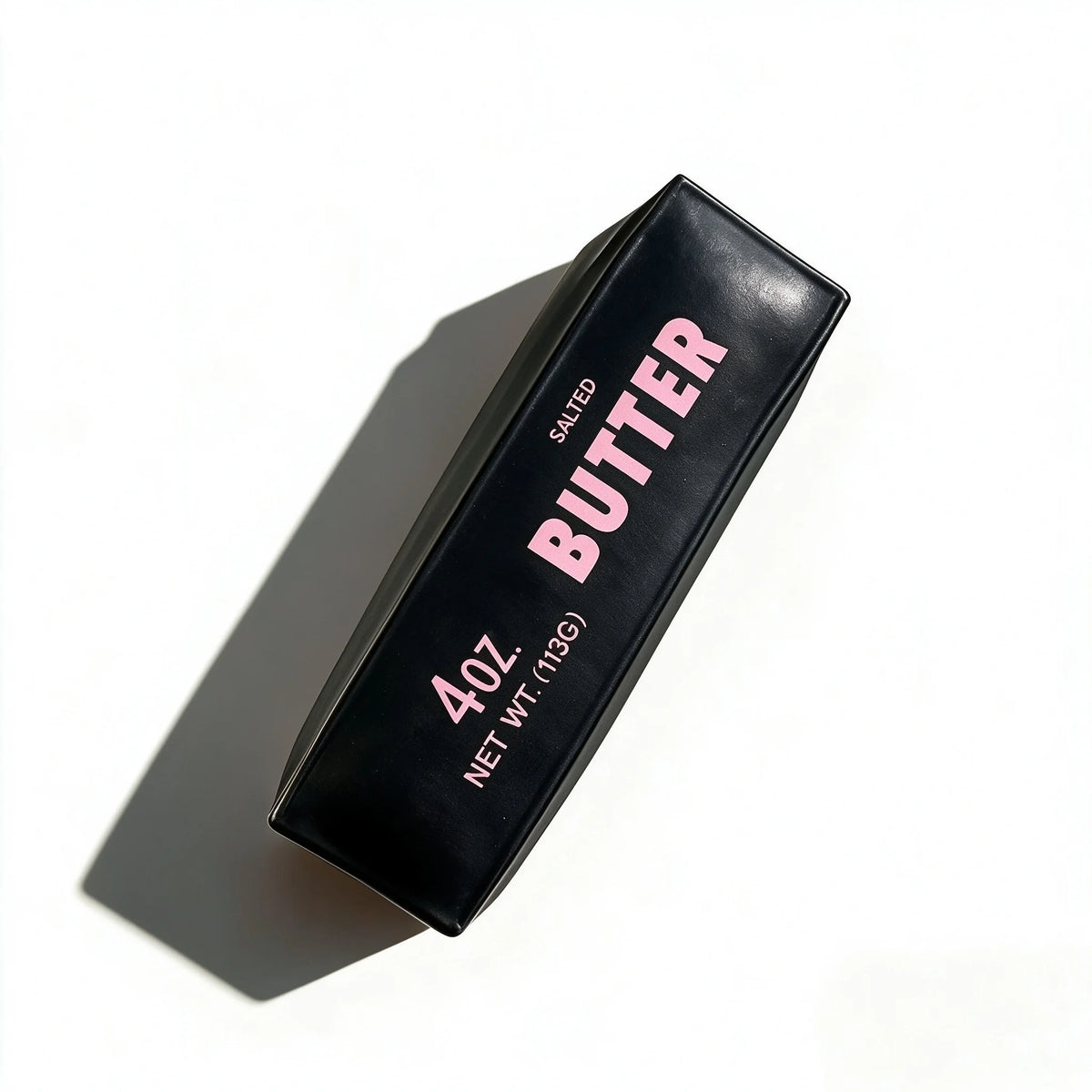 A black squeeze bottle of salted butter labeled 4 oz net weight.