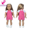 A doll wearing a pink office outfit set consisting of a sleeveless vest, skirt, and tights.
