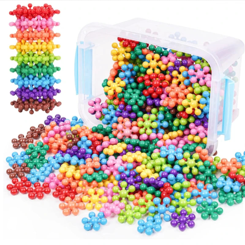 A large variety of colorful interlocking plastic building blocks spilling out of a clear container.