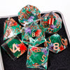 A set of handmade resin sharp edge dice in various colors and shapes resting on a black surface.