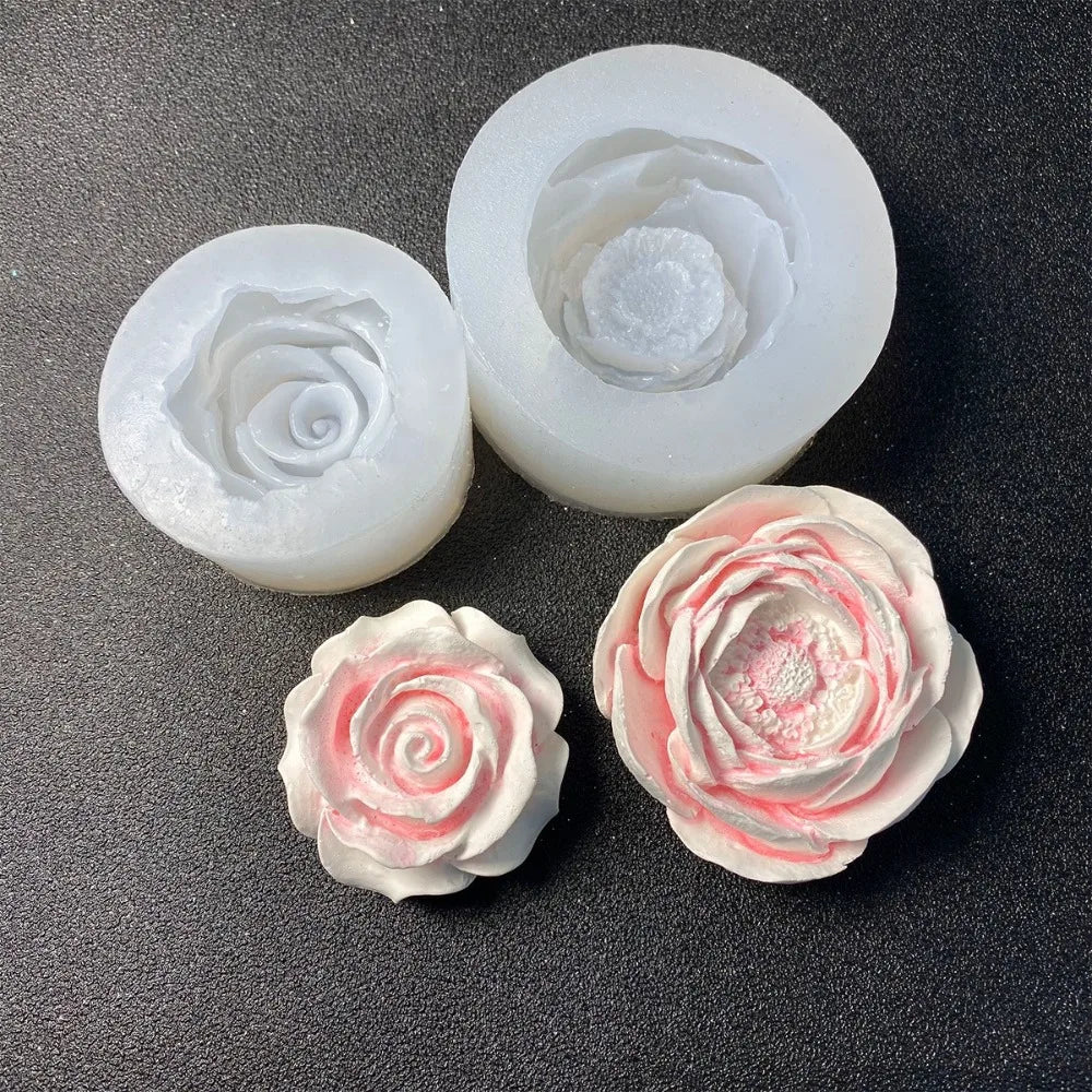 White silicone molds shaped like roses for candles, soap, and baking