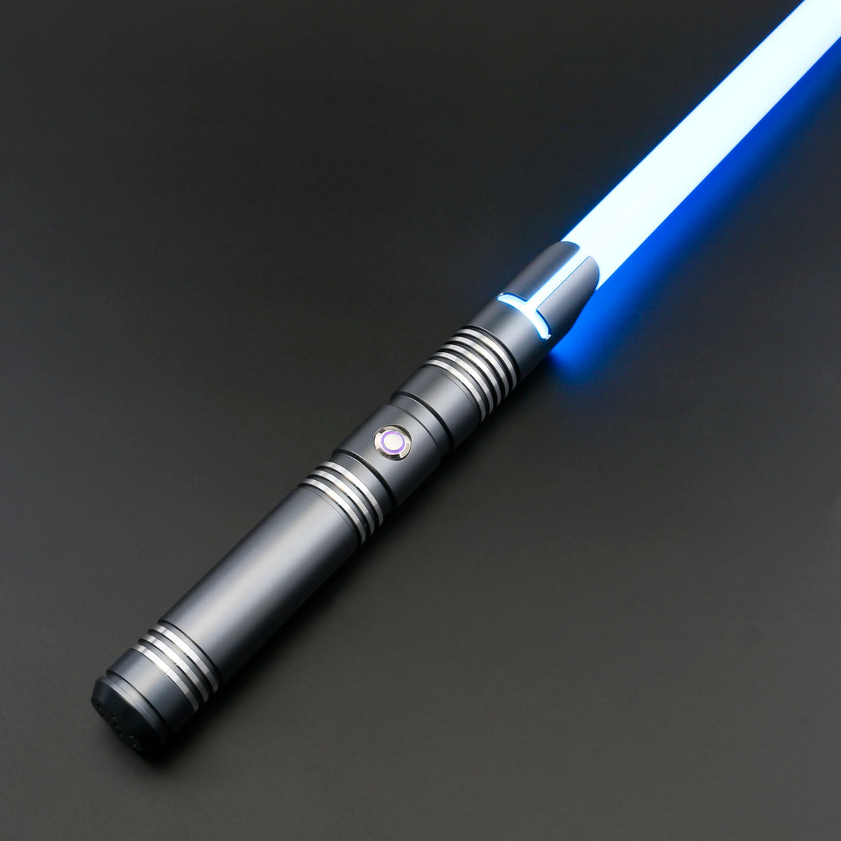 A premium metal lightsaber with a glowing blue blade and silver hilt is shown against a dark background.