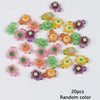 A collection of 20 mini glow-in-the-dark turtle resin figurines in various colors scattered on a white background.