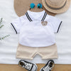 A white polo shirt and beige shorts set for toddlers with a bear embroidery, displayed on a light background.
