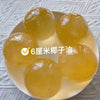 Six-centimeter yellow squeeze balls made from coconut oil for stress relief.
