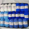 A pack of blue and white yarn skeins for knitting, crochet, and DIY crafts.