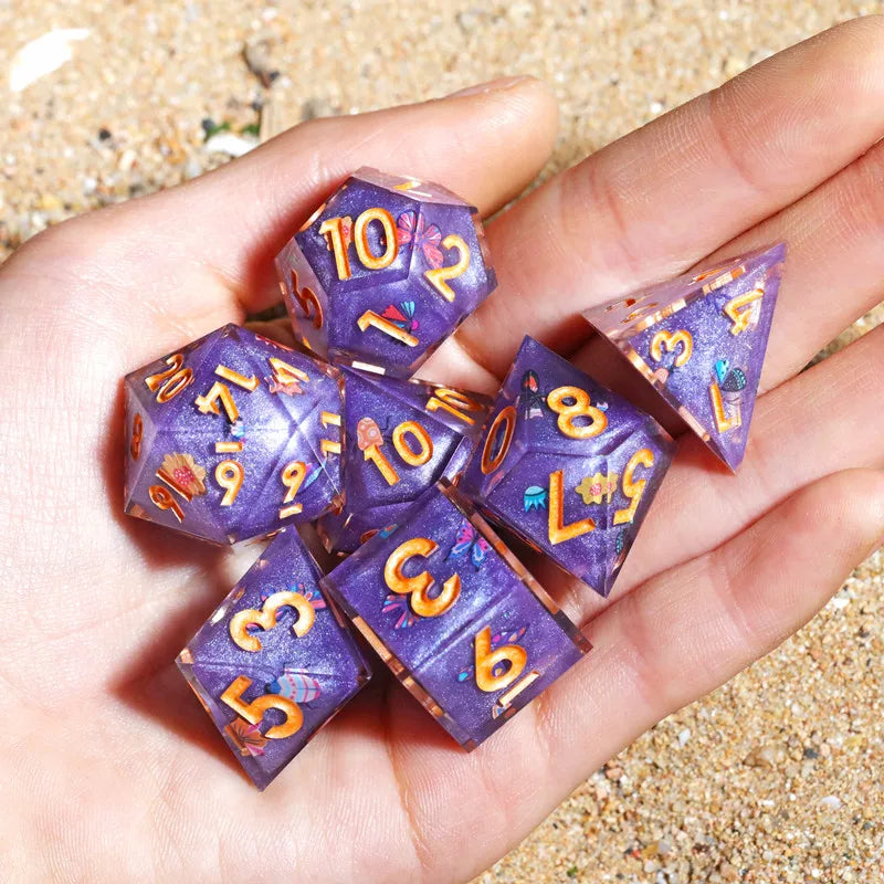 A hand holds a set of purple resin polyhedral dice showing various numbers and colors.