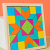 A wooden geometric shape puzzle with colorful triangular and square pieces inside a light wood frame.