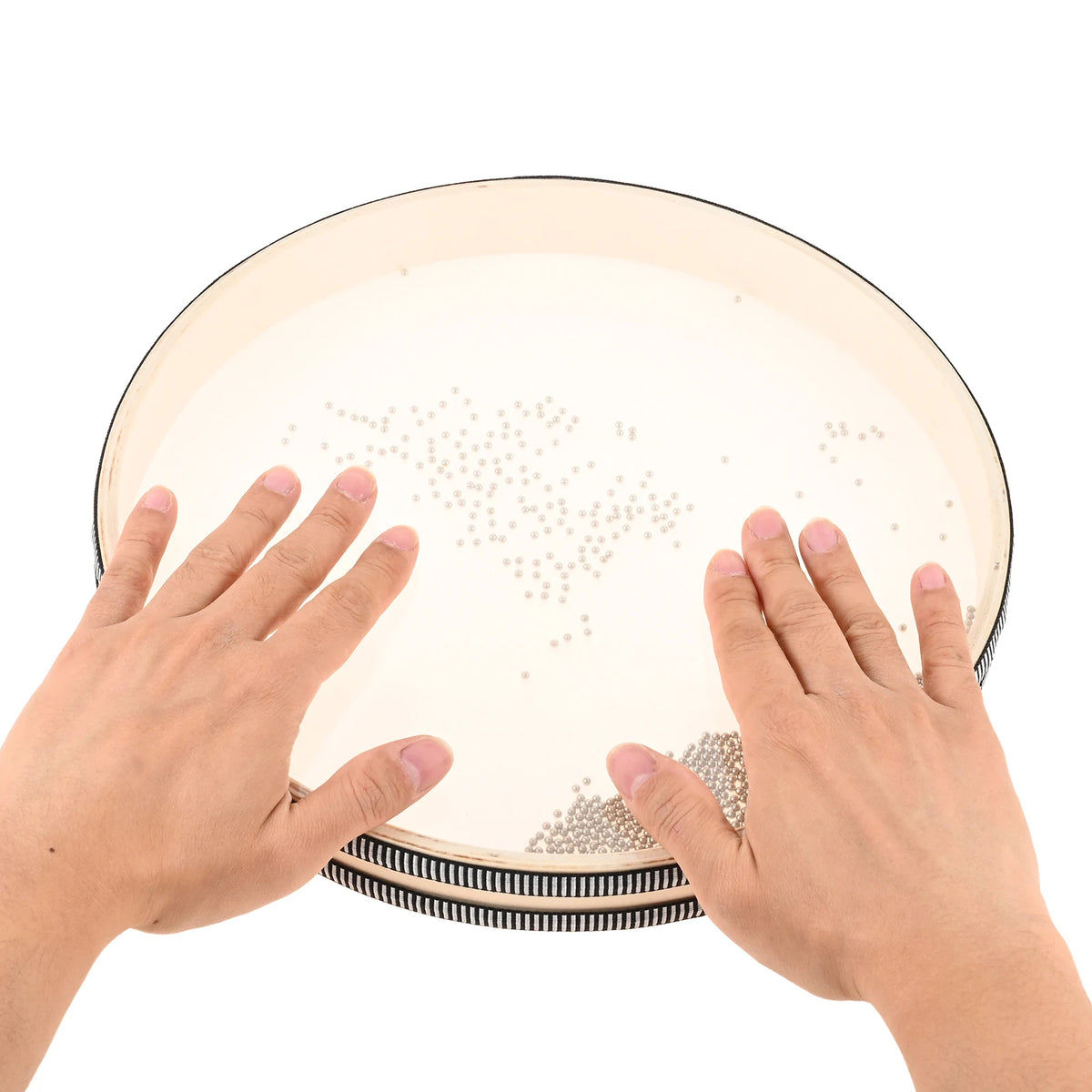 Hands holding a 12-inch ocean drum with a hardwood shell and carry bag