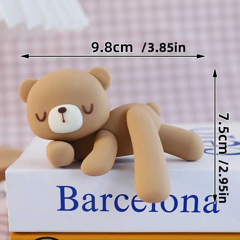 A small, light brown 3D bear cake topper with a cute face, shown next to a ruler for scale.