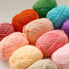 A collection of pre-dyed milk cotton yarn in various shades of green, orange, pink, and blue, showing different textures.