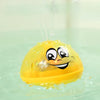 A yellow light-up bath toy is being sprayed with water in a clear container.