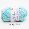 A ball of light blue and white yarn labeled Zim Jane cotton yarn for knitting and crochet