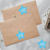 A brown envelope featuring a light blue star design with the text Boy team for baby shower stickers