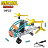 A yellow and black metal model off-road vehicle or excavator engineering kit with various components.