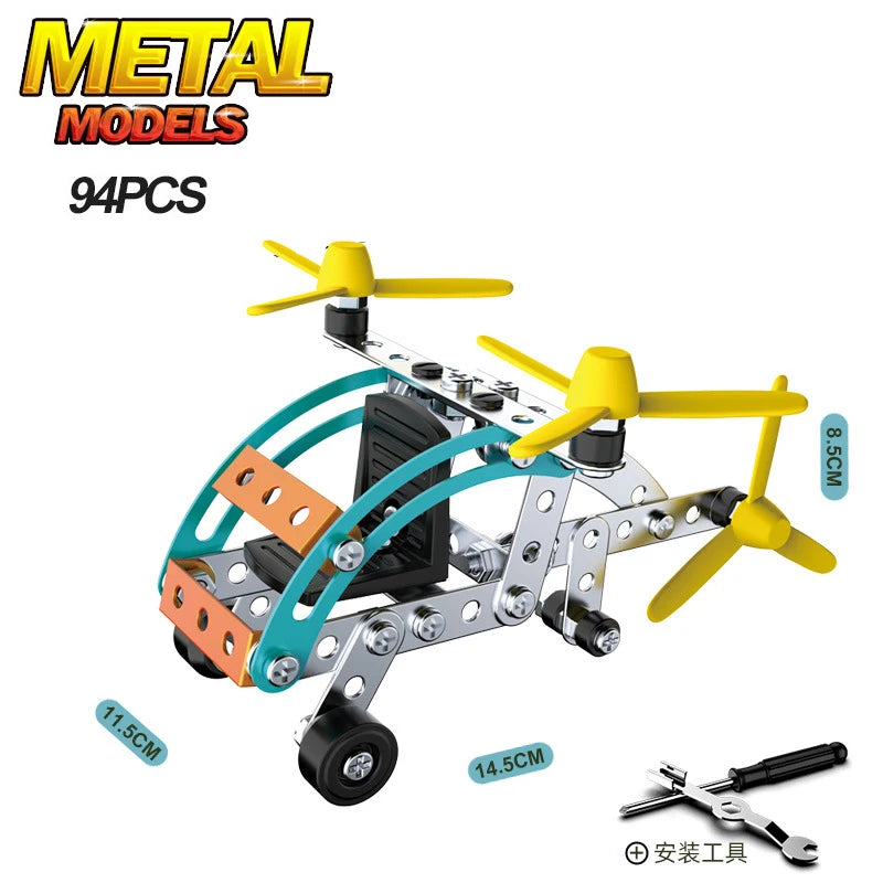 A yellow and black metal model off-road vehicle or excavator engineering kit with various components.