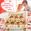 A stack of four classic 14 inch plush teddy bears in brown and beige tones.