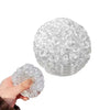 A clear, spherical stress relief ball made of many small, tightly packed, squishy bubbles.