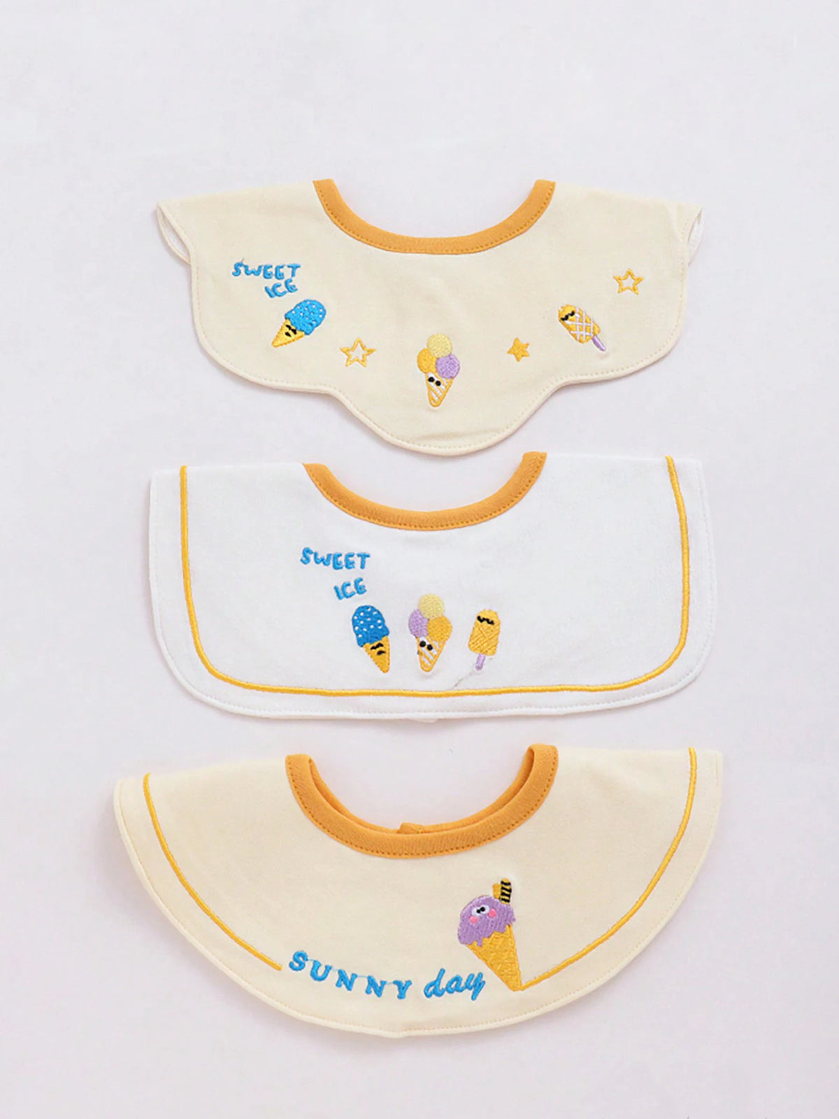 A set of three baby waterproof drool bibs featuring sweet ice cream and sunny day designs.