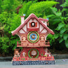 A detailed wooden cuckoo clock puzzle kit featuring a house design and a cuckoo bird.