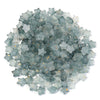 A pile of small, transparent, star-shaped acrylic beads in a bluish-green color.