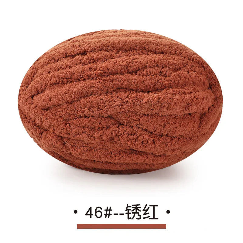 A ball of reddish-brown chunky chenille yarn for hand knitting