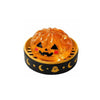 An orange glitter pumpkin Halloween squishy fidget toy set with an eyeball and skull inside a wooden tray