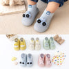 A collection of adorable animal soft sole socks for babies and toddlers in various colors and designs.
