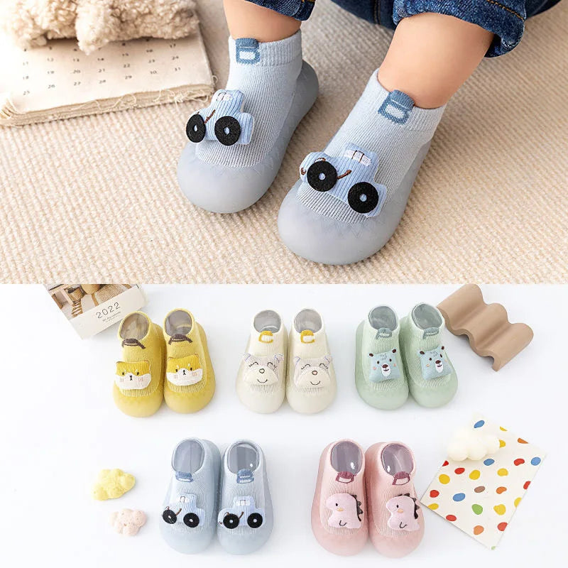 A collection of adorable animal soft sole socks for babies and toddlers in various colors and designs.