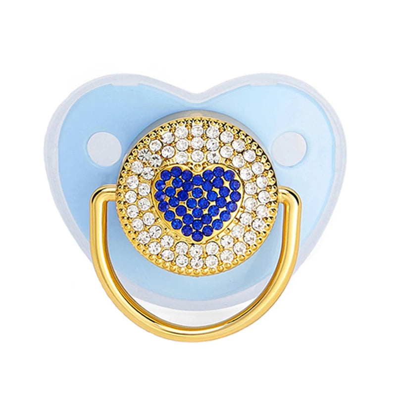 Rose gold crystal bling pacifier with a heart design and a gold ring for newborns