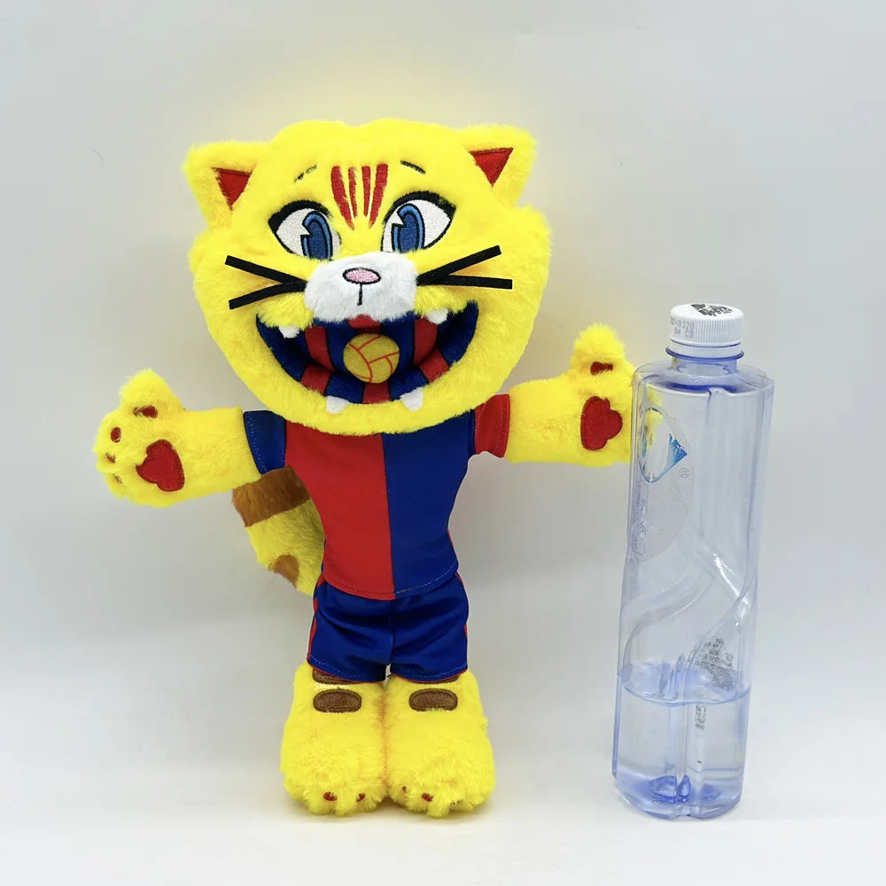 A yellow and red football mascot cat plush toy standing next to a clear plastic water bottle.