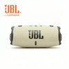 JBL Charge 6 portable waterproof Bluetooth speaker in beige and black.